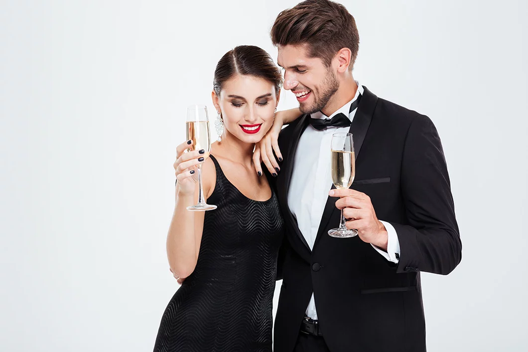 man-woman-drinking-champagne-and-wearing-custom-fit-suits-and-dress