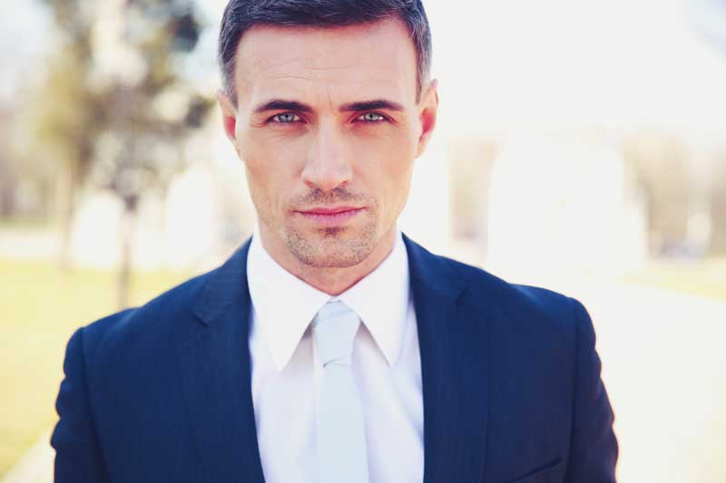 Picture-of-good-looking-middle-aged-man-with-custom-suit-staring-back-at-you